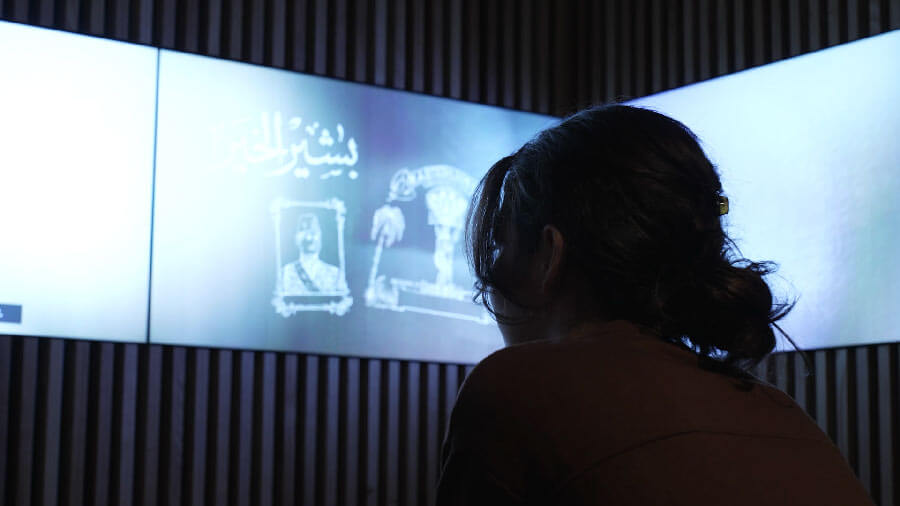 A woman engaging with content at the Manchester Jewish Museum